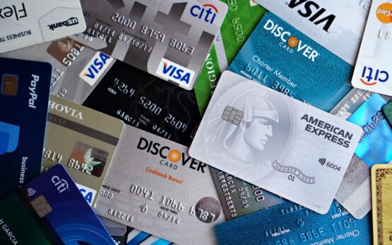 A flat lay of assorted credit and debit cards from various banks. Ideal for finance and banking concepts.